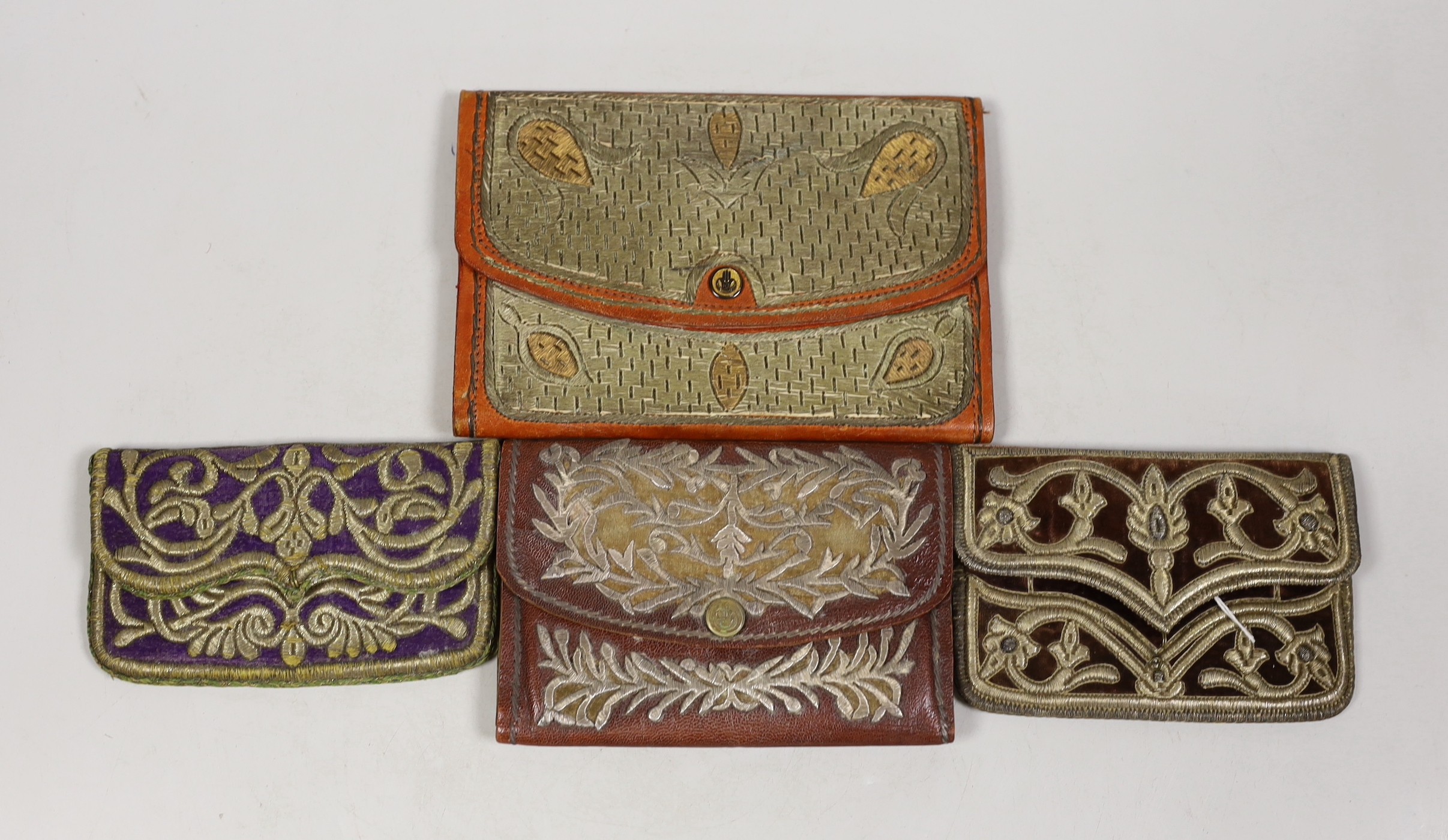 Four Turkish gold and silver metallic embroidered purses, two 19th century, embroidered on velvet and two early 20th century, embroidered on Morocco leather